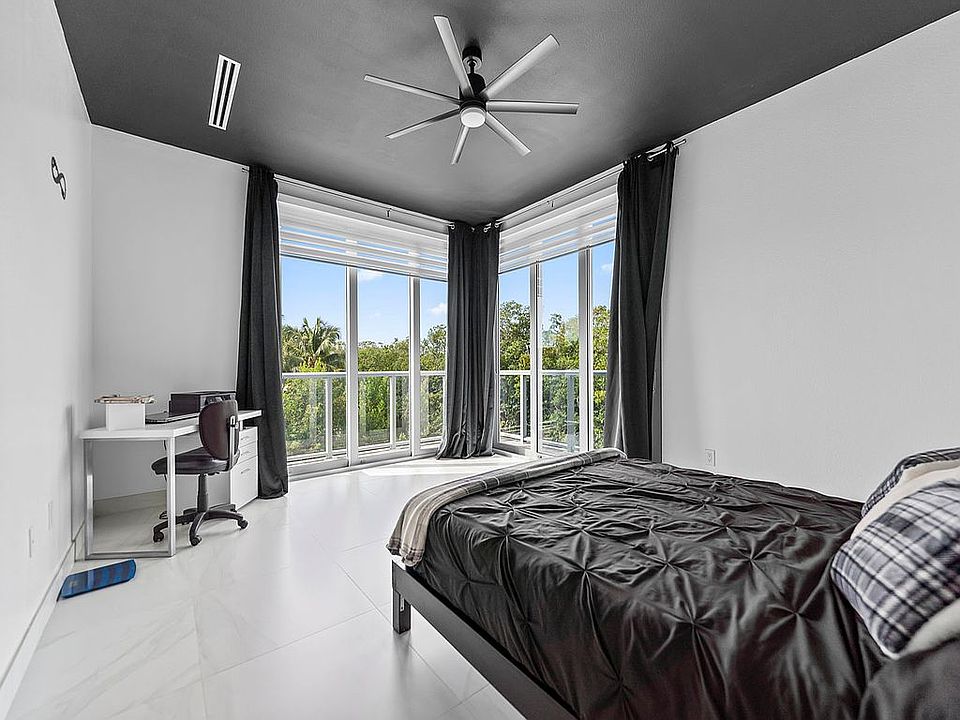 Bedroom with waterfront-facing glass